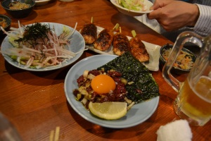 Variou Food: daikon salad (ume sauce), sakura yukke (horse), and some meatloaf-like chicken on skewers